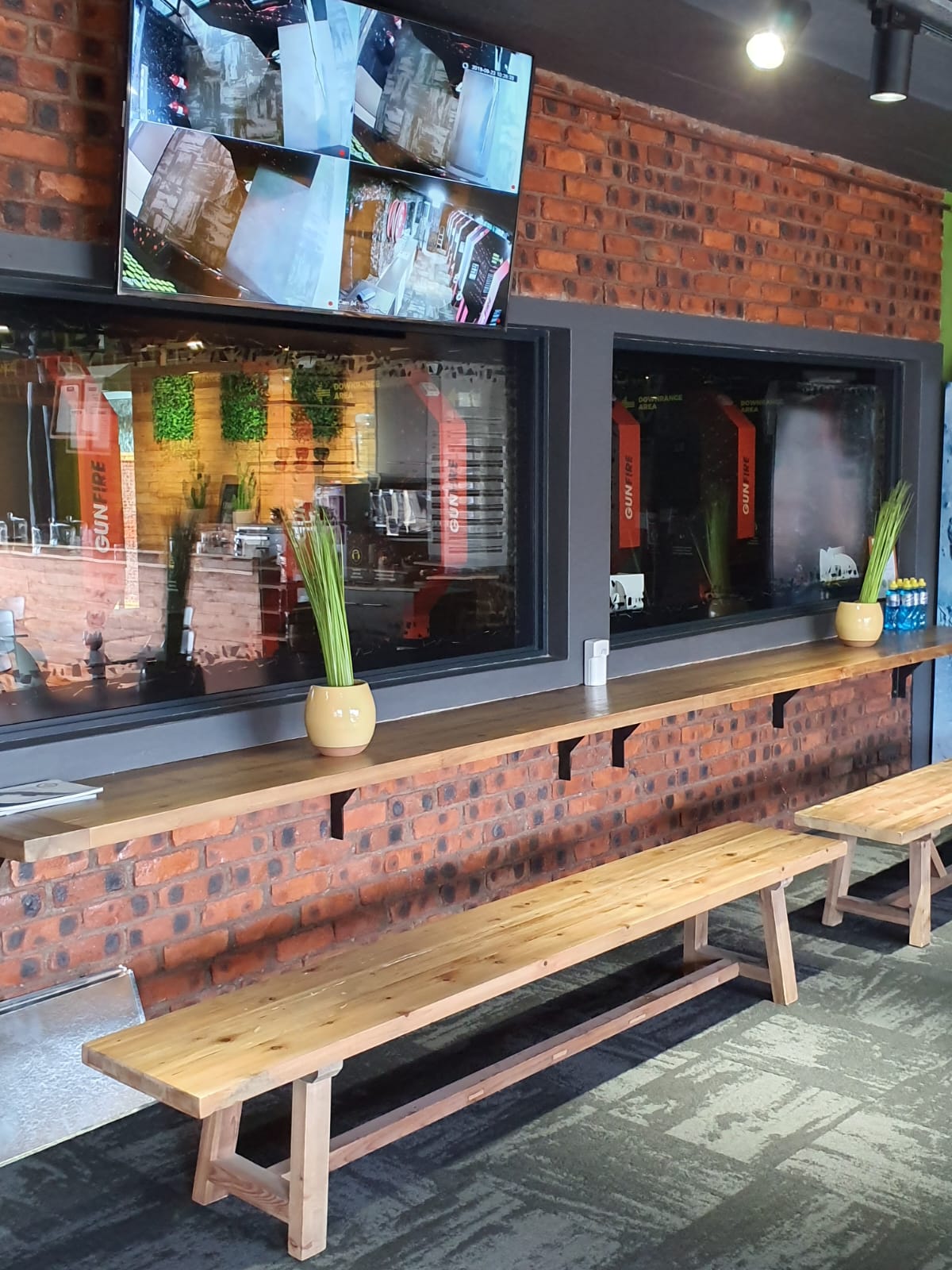 Bench seating and timber worktop along the GUNFIRE range viewing windows
