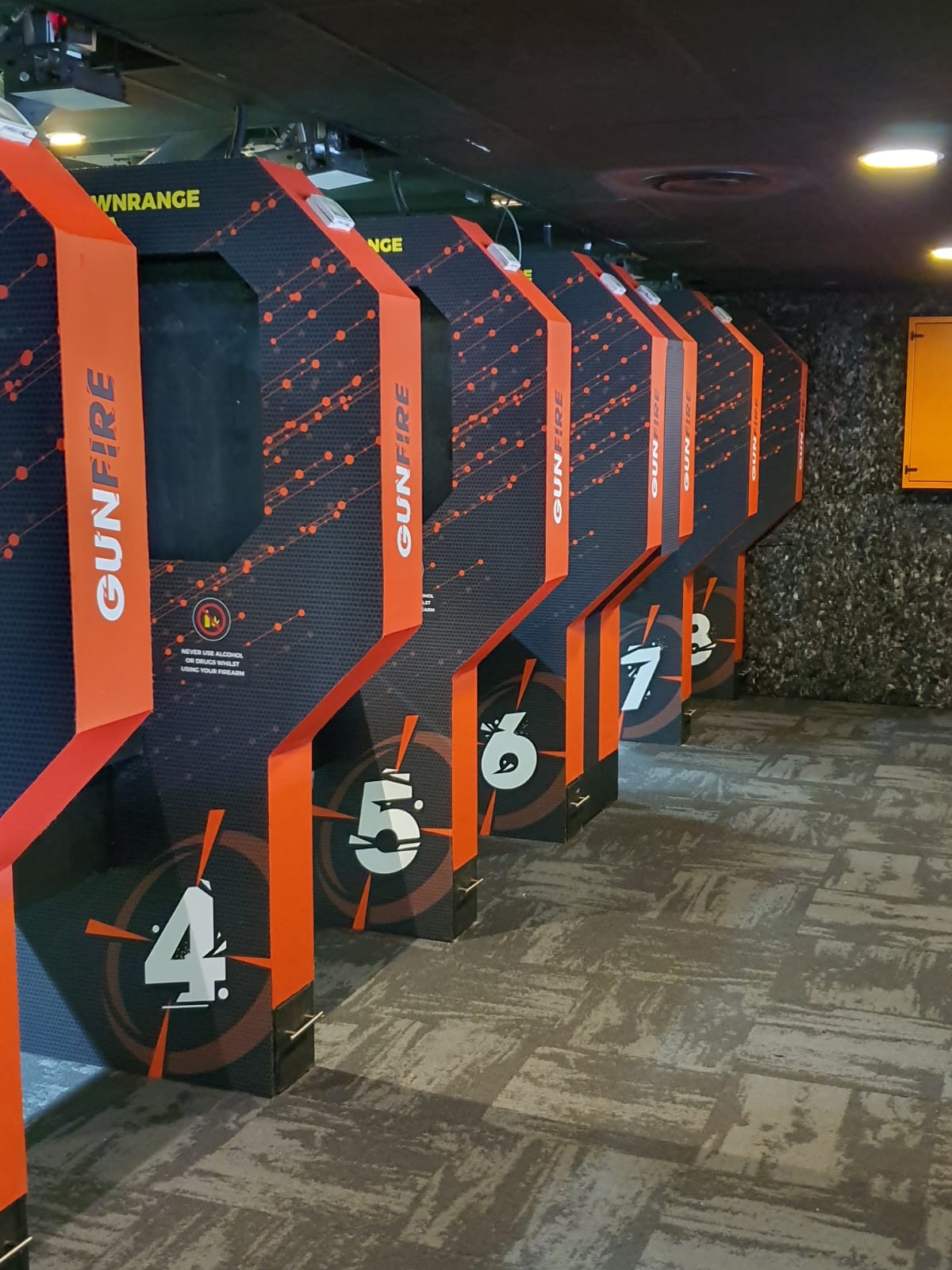 GUNFIRE indoor range firing bays, numbered four to eight